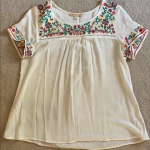 Off white top, embroidered floral detail.